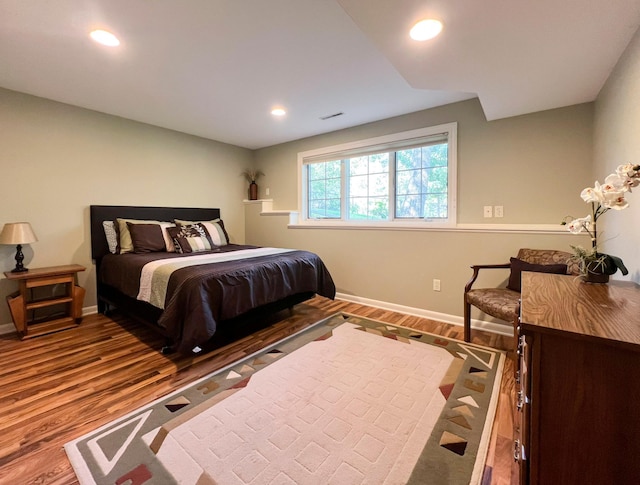 bedroom featuring wood-type flooring