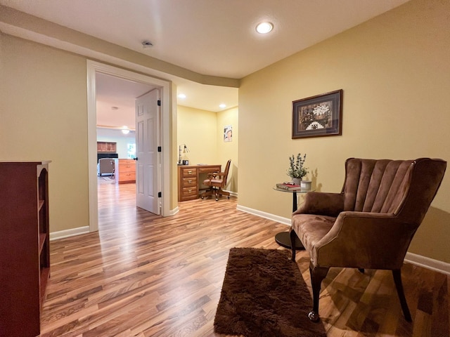 sitting room featuring hardwood / wood-style floors