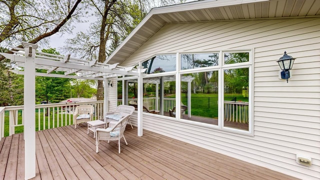 wooden terrace featuring a lawn and a pergola