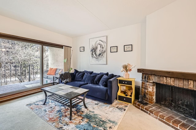 living room featuring a fireplace and dark carpet