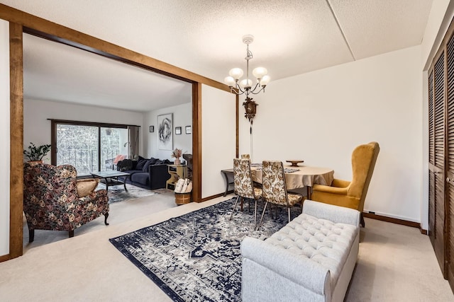 dining area featuring light colored carpet, a textured ceiling, and a notable chandelier