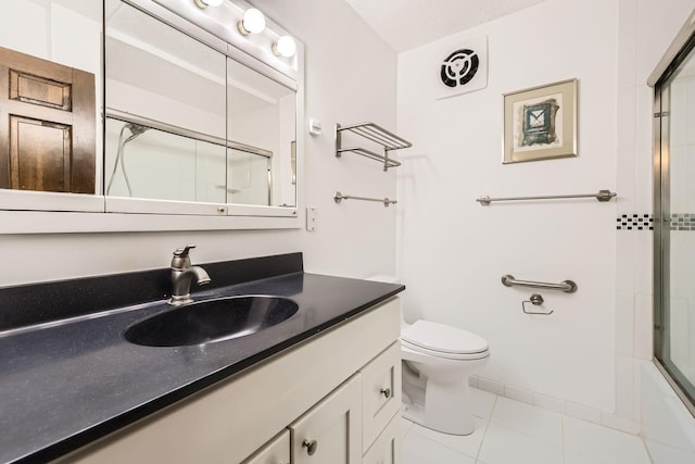 full bathroom featuring vanity, tile patterned floors, shower / bath combination with glass door, and toilet