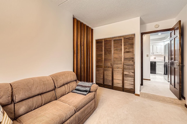 living room with light carpet and a textured ceiling