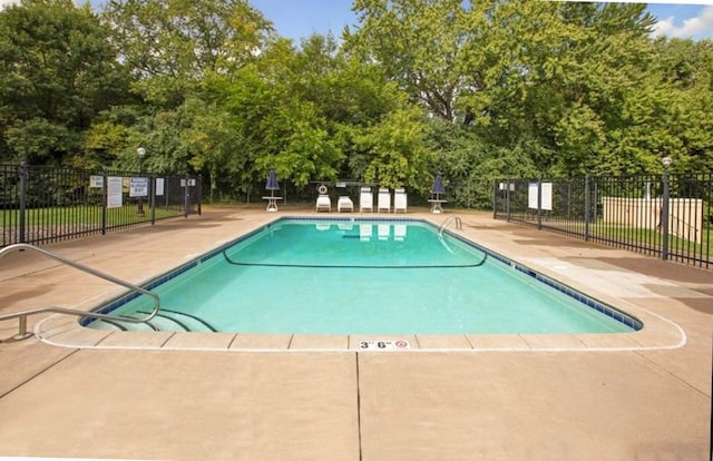 view of pool featuring a patio