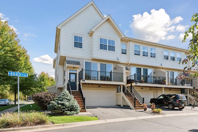 townhome / multi-family property featuring a garage