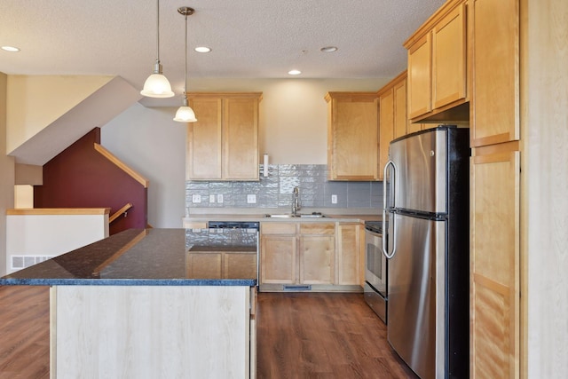 kitchen featuring a kitchen island, appliances with stainless steel finishes, sink, and light brown cabinetry