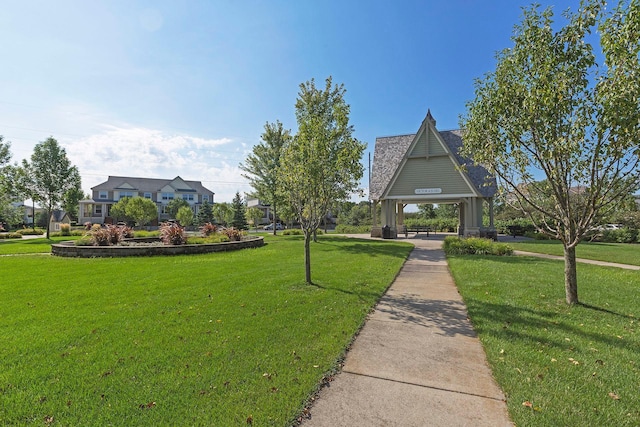 view of home's community featuring a lawn