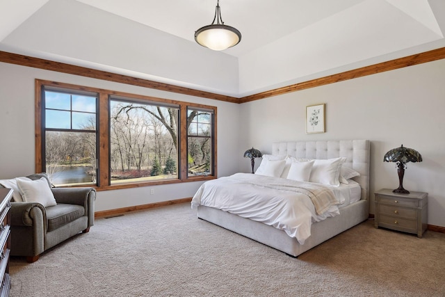 bedroom featuring lofted ceiling and light carpet