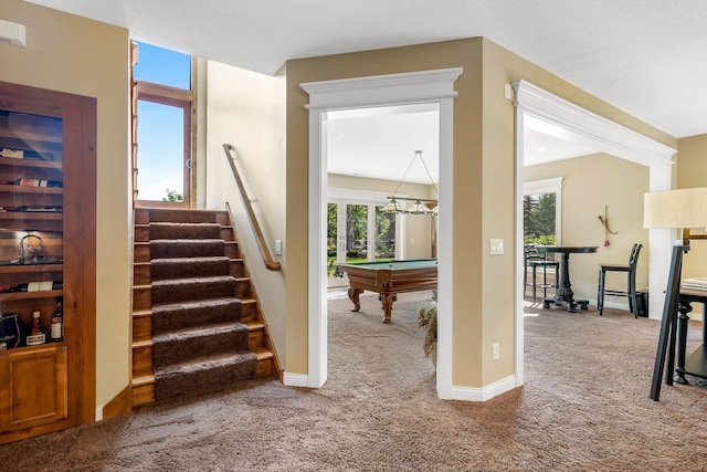 stairway featuring billiards and carpet floors