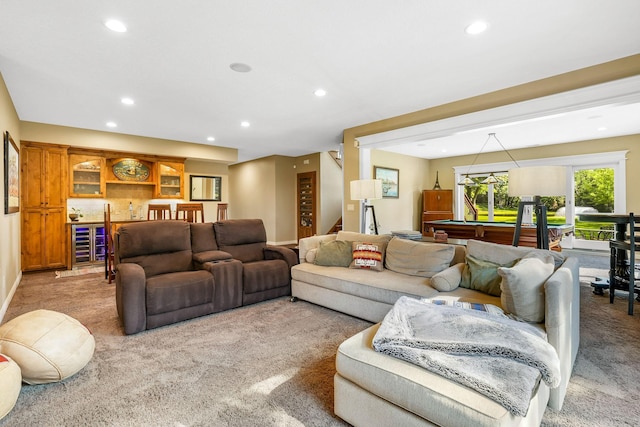 carpeted living room with pool table and beverage cooler