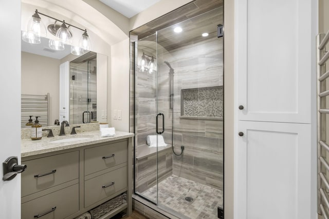 bathroom with vanity and walk in shower