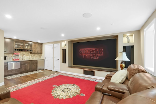 living room featuring dark wood-type flooring and indoor wet bar