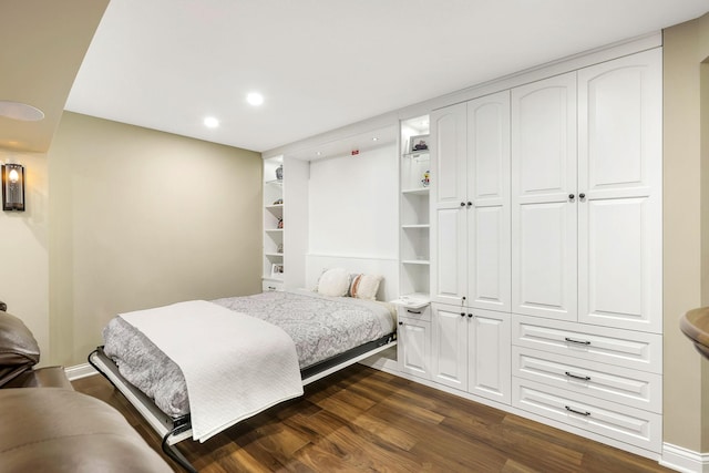 bedroom featuring dark hardwood / wood-style flooring