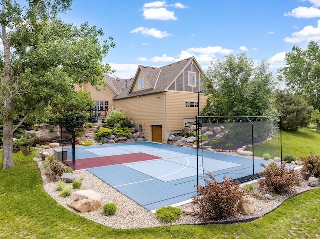 view of basketball court featuring a lawn