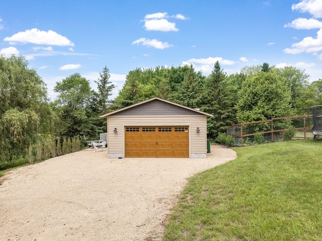 garage featuring a yard