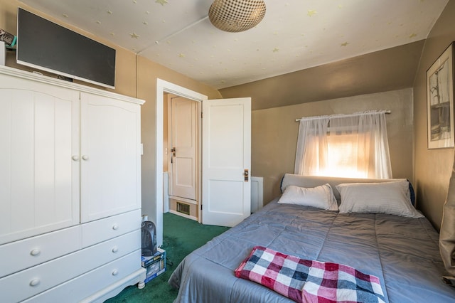 bedroom featuring dark colored carpet