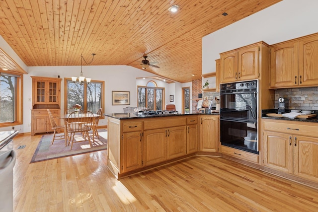 kitchen with dobule oven black, a peninsula, lofted ceiling, light wood-type flooring, and wood ceiling