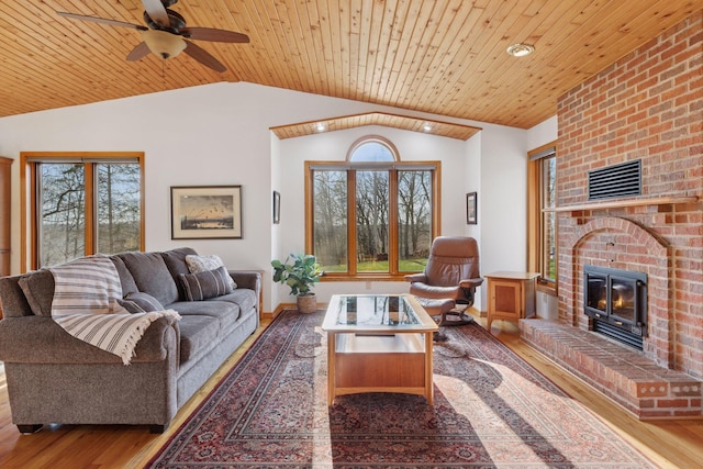 living room featuring wood ceiling, vaulted ceiling, and wood finished floors