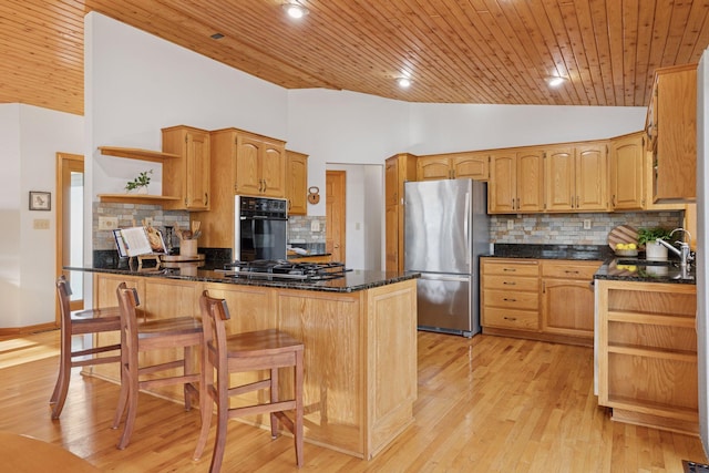kitchen featuring open shelves, a peninsula, lofted ceiling, appliances with stainless steel finishes, and backsplash