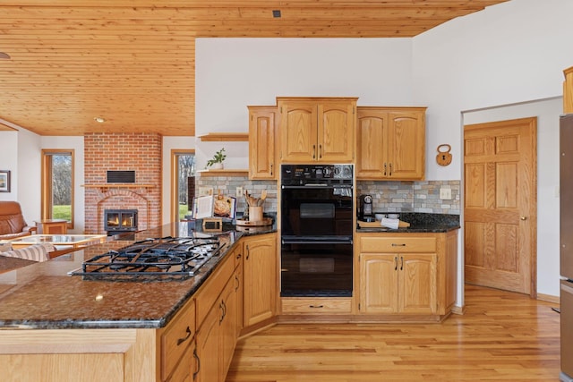 kitchen with wood ceiling, open shelves, black appliances, open floor plan, and dark stone counters