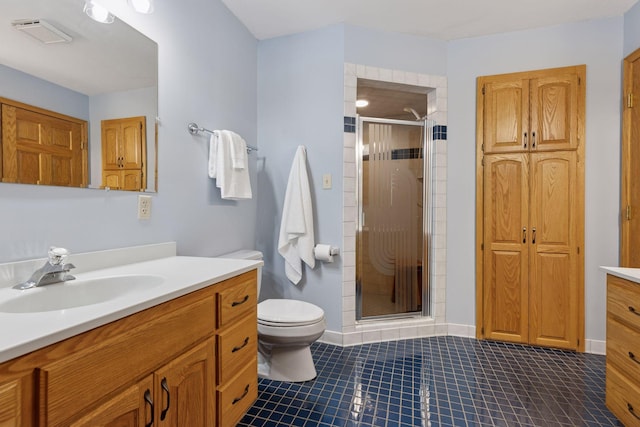 bathroom with vanity, tile patterned flooring, visible vents, toilet, and a stall shower