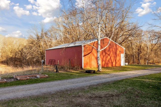 view of pole building with a lawn