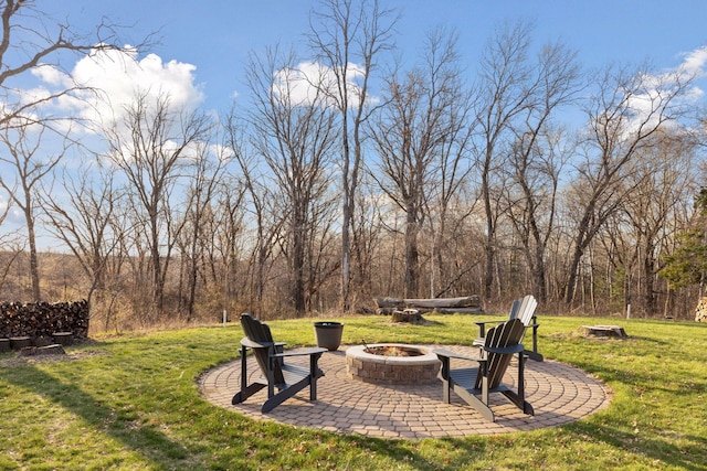 view of yard with a patio and a fire pit