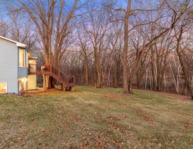 view of yard with a wooden deck and stairs