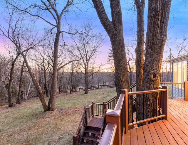 deck at dusk with a lawn
