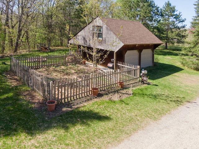 surrounding community featuring an outbuilding and a garage
