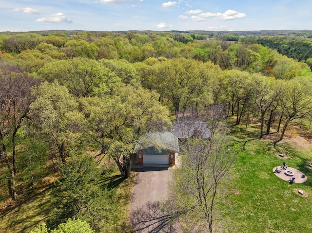 view from above of property with a heavily wooded area