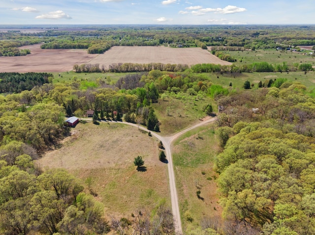 aerial view of sparsely populated area featuring a forest