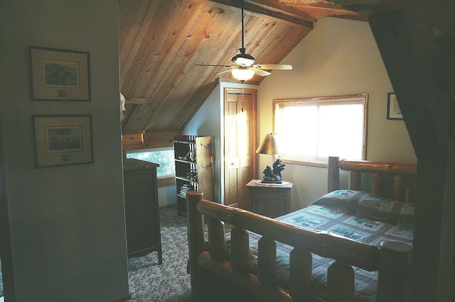 carpeted bedroom with multiple windows, wooden ceiling, and lofted ceiling