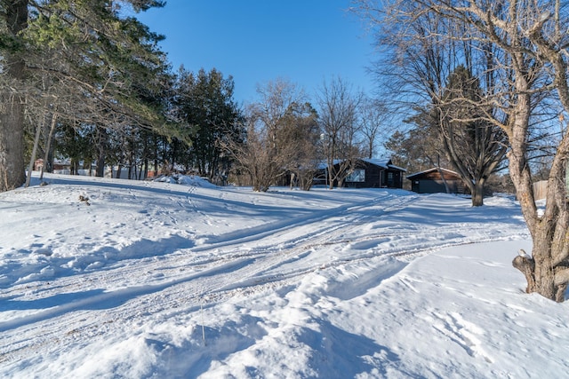 view of yard layered in snow