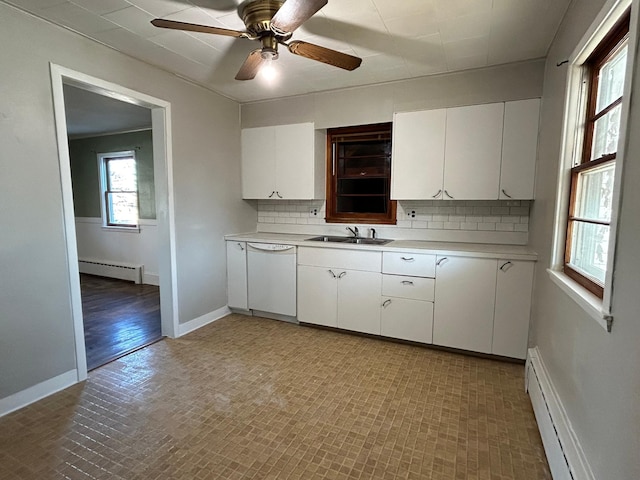 kitchen featuring white cabinetry, sink, dishwasher, and baseboard heating