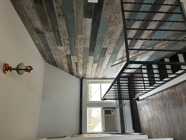 stairs with lofted ceiling and wood ceiling