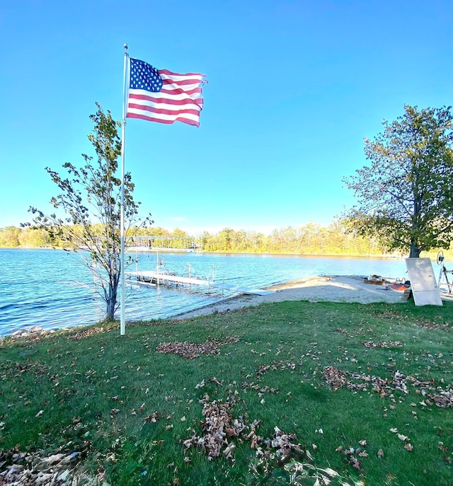 exterior space with a water view and a yard