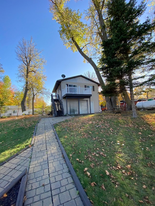 view of property exterior featuring a yard and a garage