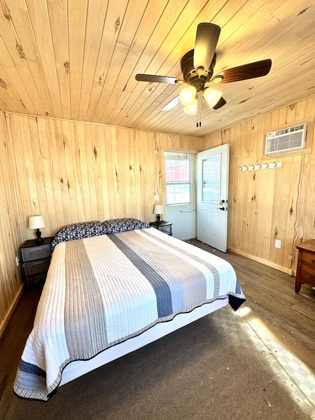 bedroom with an AC wall unit, wooden ceiling, dark hardwood / wood-style flooring, and wood walls