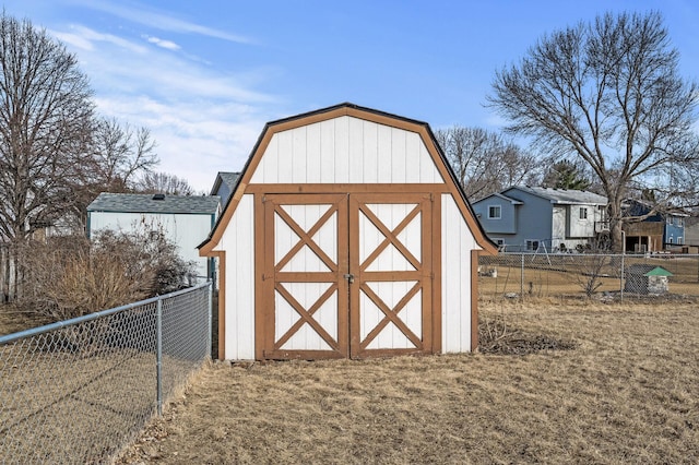 view of shed featuring fence