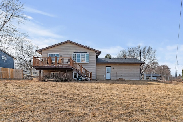 back of house featuring a wooden deck, a yard, stairway, and fence