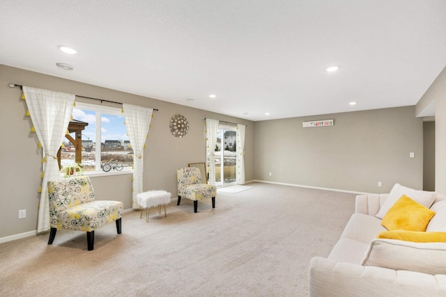 sitting room featuring light carpet