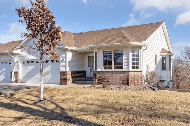 view of front of house with a garage and a front yard