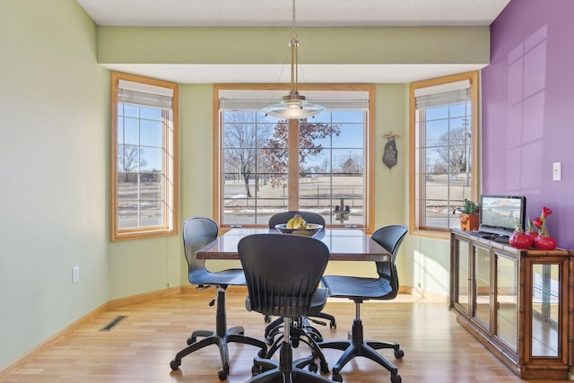 dining area with light hardwood / wood-style floors