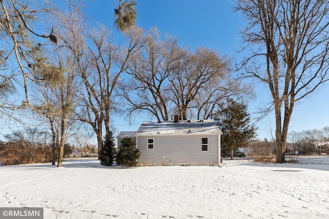 view of snow covered property