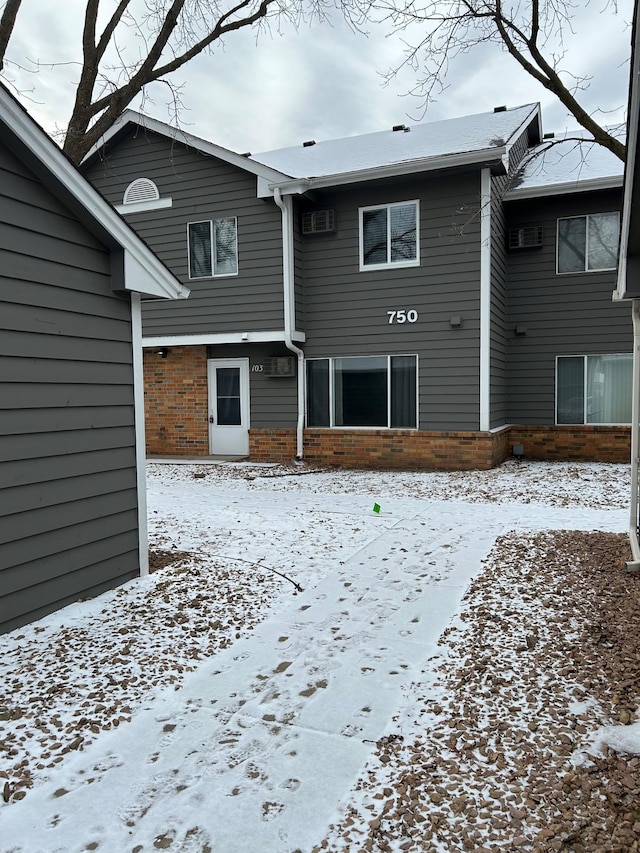 view of snow covered property