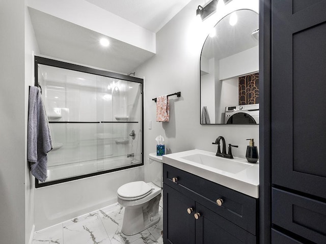 full bathroom featuring enclosed tub / shower combo, vanity, and toilet