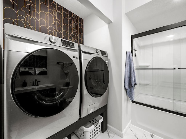 laundry room featuring washer and clothes dryer