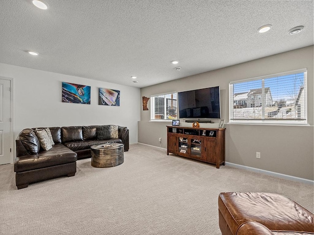 living room featuring carpet and a textured ceiling