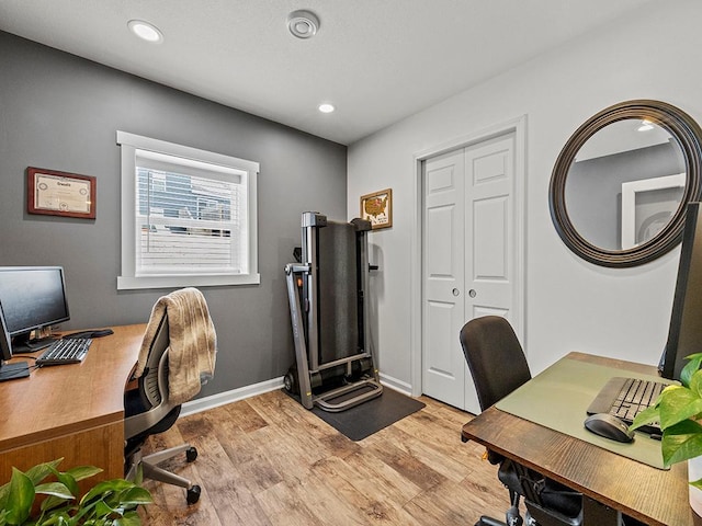 home office with baseboards, light wood finished floors, and recessed lighting